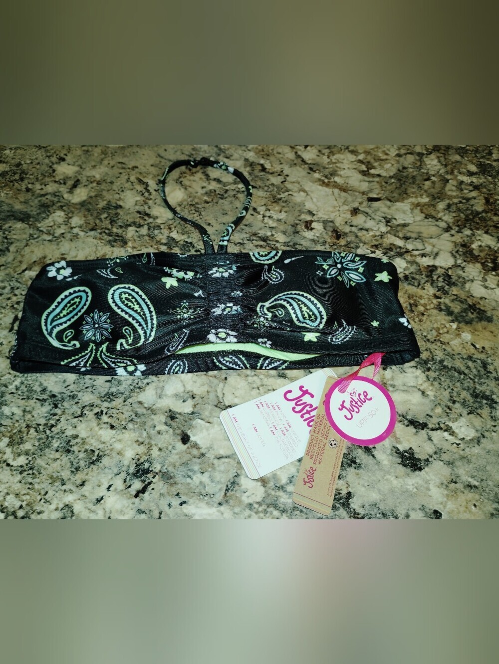 Justice bandeau swim top in black with green paisley and floral accents. 10